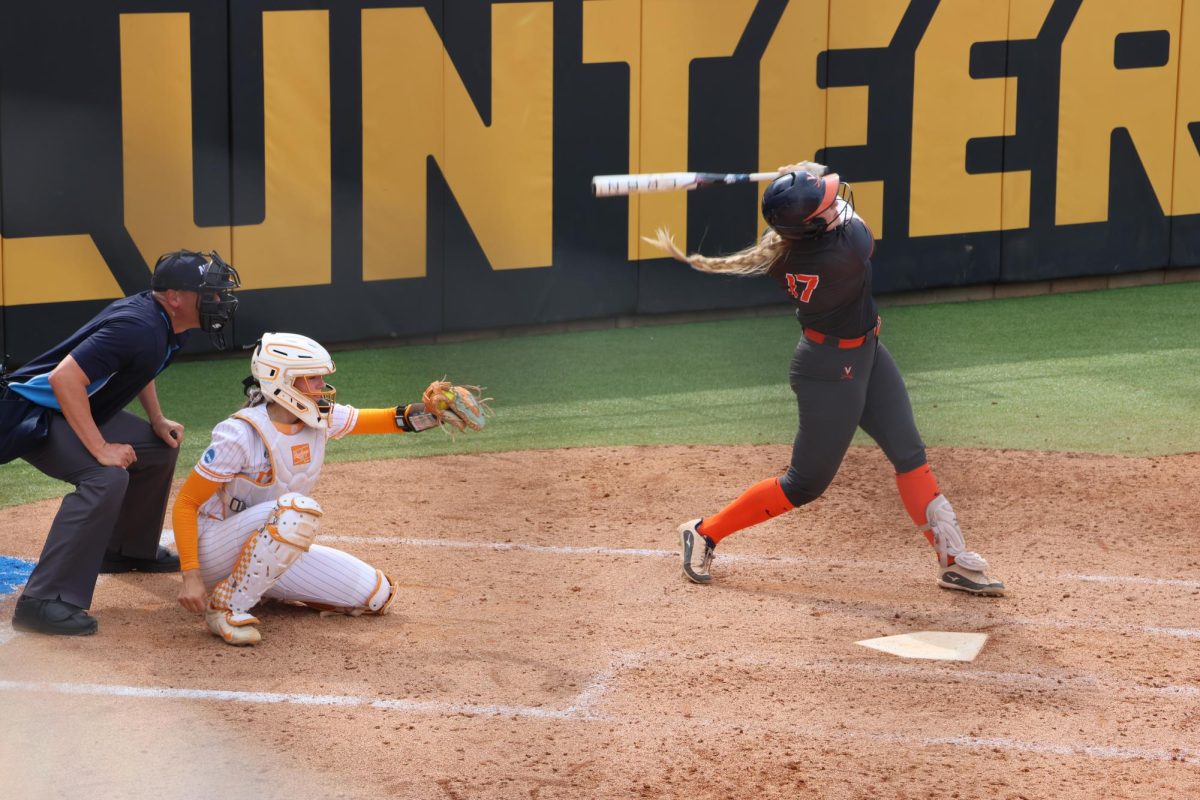 Tennessee Lady Vols catcher Elsa Morrison catches a strike as Virginia Lady Hoos Reagan Hickey swings her bat on Saturday, May 16, 2026, in Knoxville, Tenn.